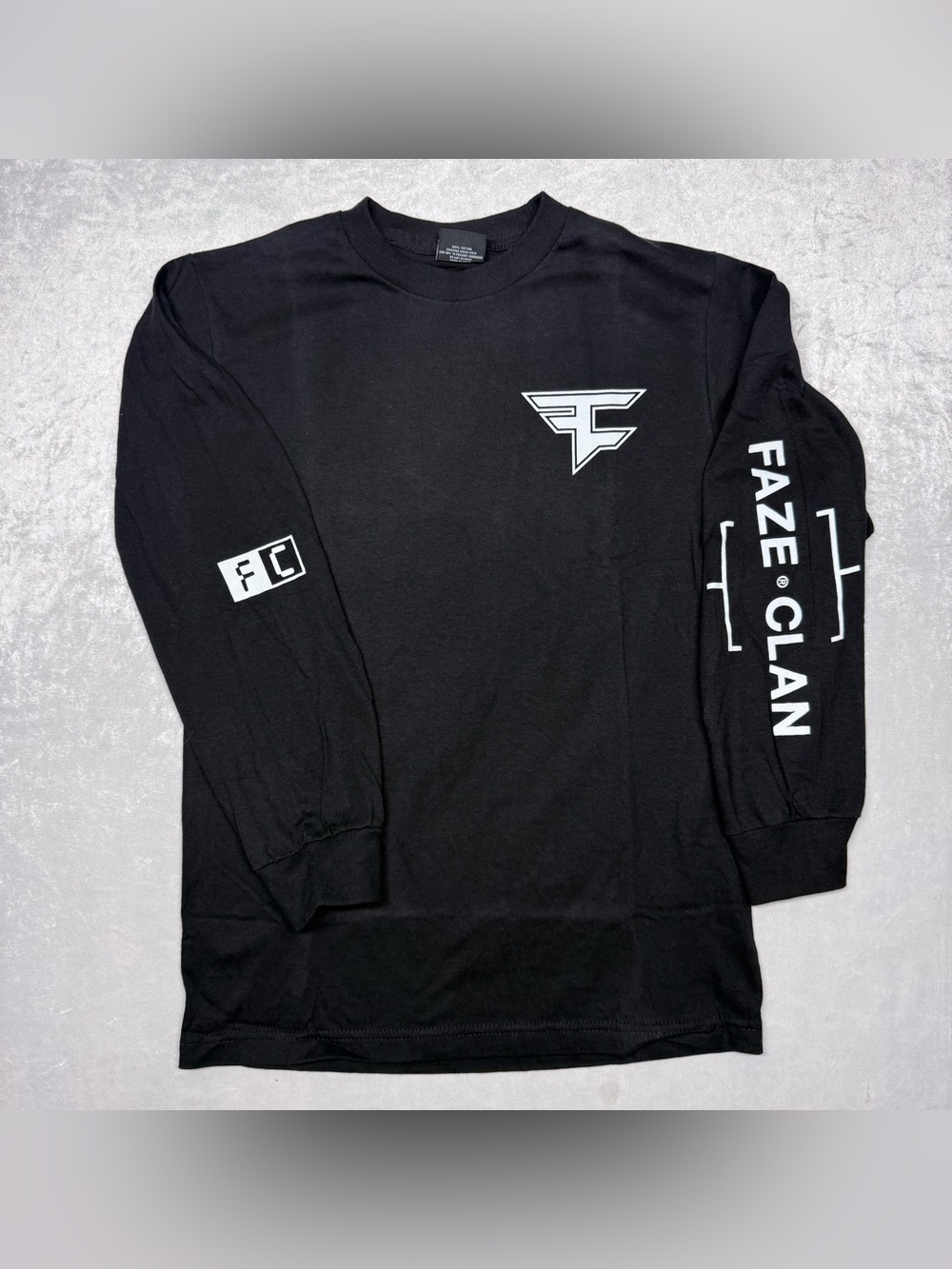 Black Long Sleeve T-Shirt Featuring a Graphic Print of the White FaZe Clan Logo